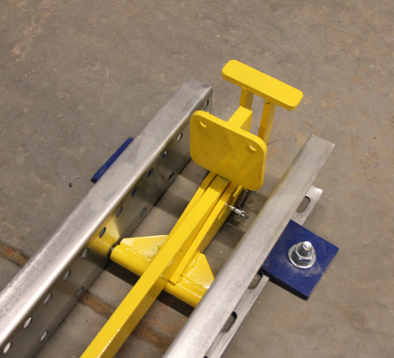Pallet Hold Back Device For Flow Lanes Concentric Storage Systems